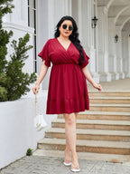 Plus Size Ruched Surplice Flounce Sleeve Mini Dress - LoveNest Treasures