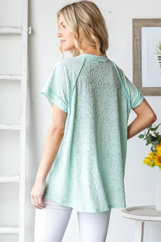Heimish Full Size Exposed Seam V-Neck Short Sleeve Leopard Top Plus Size - LoveNest Treasures