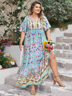 Plus Size Printed Tie Neck Flutter Sleeve Maxi Dress - LoveNest Treasures
