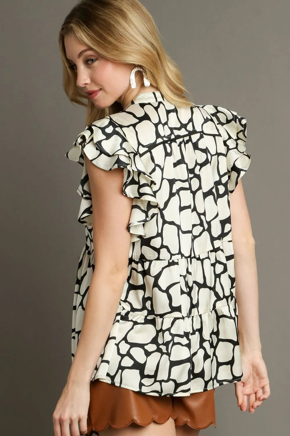 Umgee Full Size Two Tone Animal Print Notched Ruffle Cap Sleeve Blouse Plus Size - LoveNest Treasures