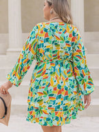 Plus Size Printed Surplice Long Sleeve Mini Dress - LoveNest Treasures