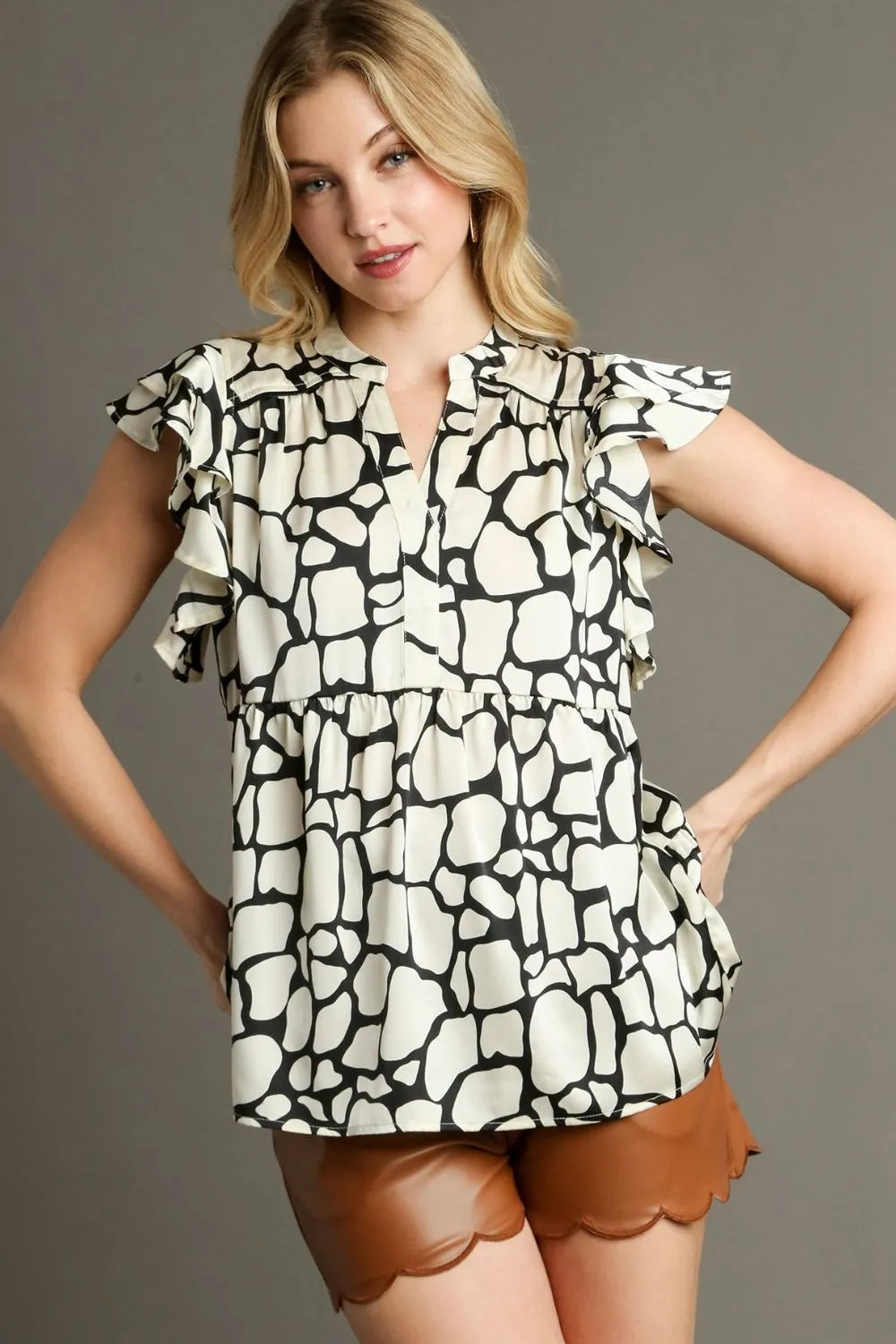 Umgee Full Size Two Tone Animal Print Notched Ruffle Cap Sleeve Blouse Plus Size - LoveNest Treasures
